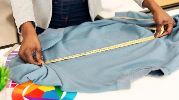 Woman sizing a shirt